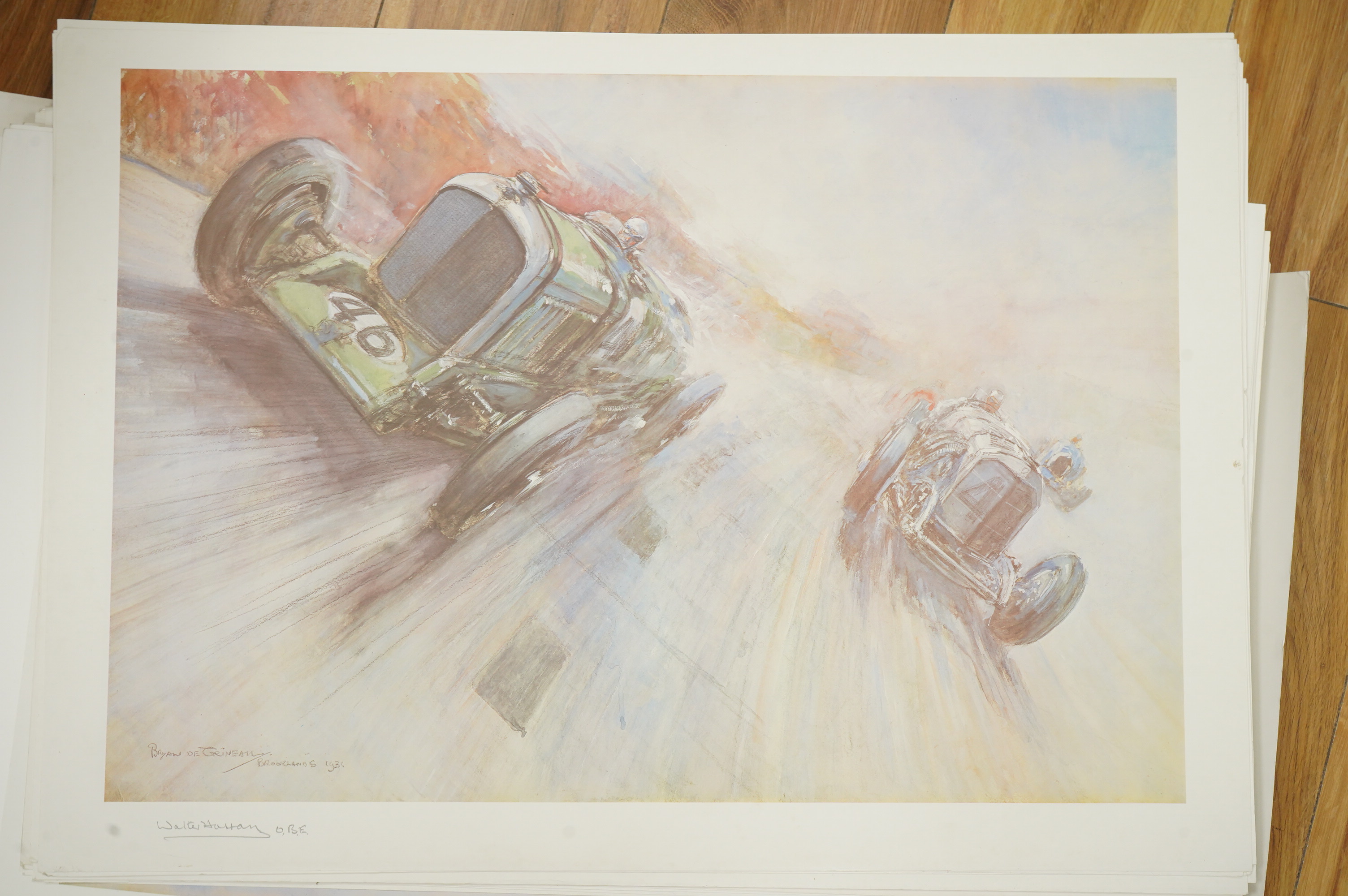 Two framed and signed motor racing lithographs by Anthony Heal and Walter Hassan of Le Mans and Brookslands racing scenes, the largest frame 61.5 x 76cm, together with a folio containing a large number of unframed simila